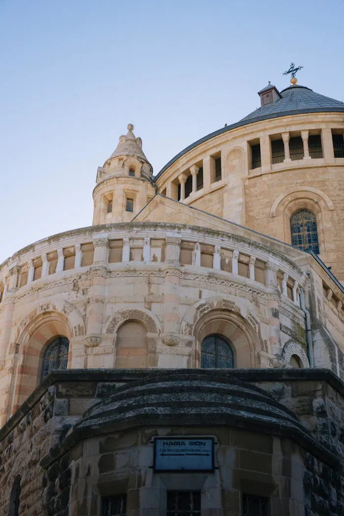 Stunning view of an ancient churchs detailed facade in Jerusalem.